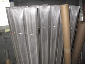 Rolls of stainless steel wire cloth stored upright