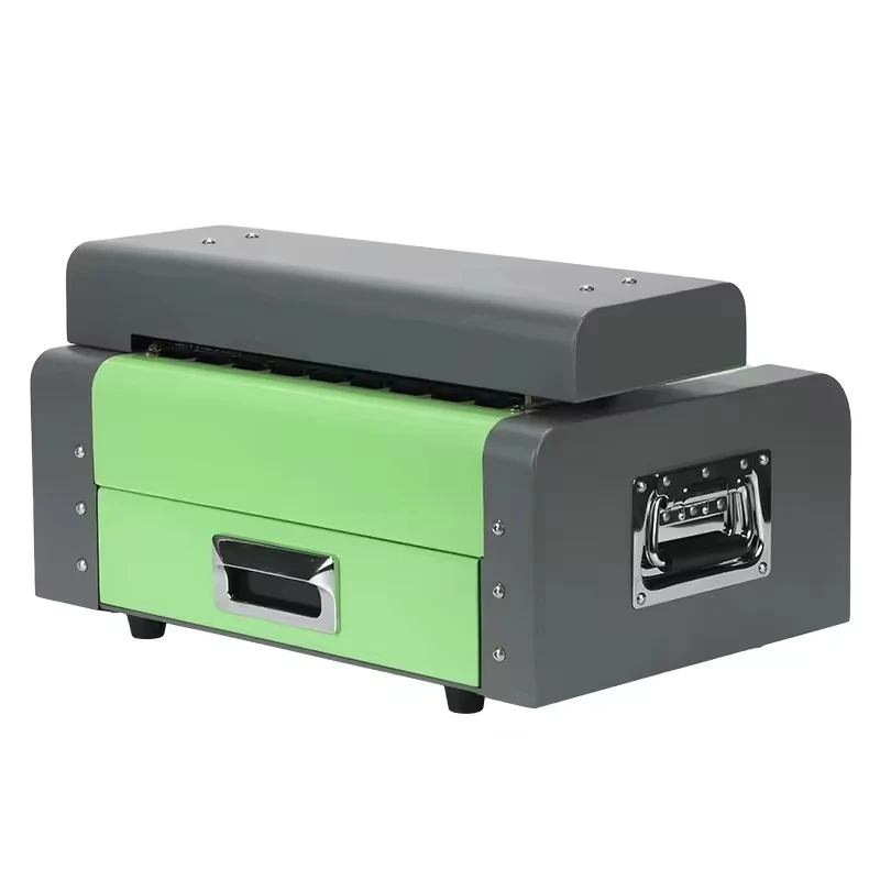 Green and grey industrial machine with metal handles