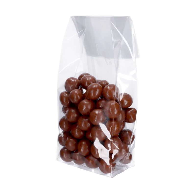 Clear plastic bag containing brown, round, candy-like spheres.