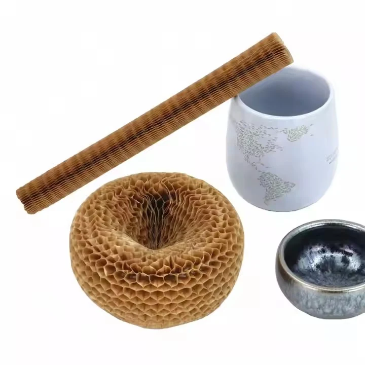 Honeycomb cardboard pieces and two ceramic cups on a white background