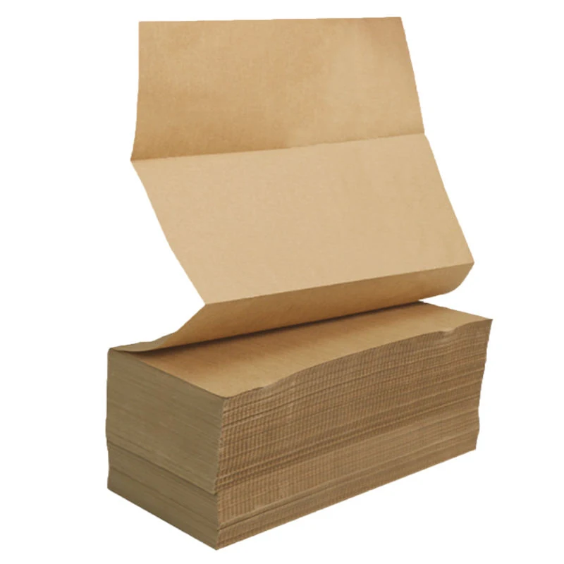 Stack of brown kraft paper sheets with the top sheet partially unfolded, isolated on a white background