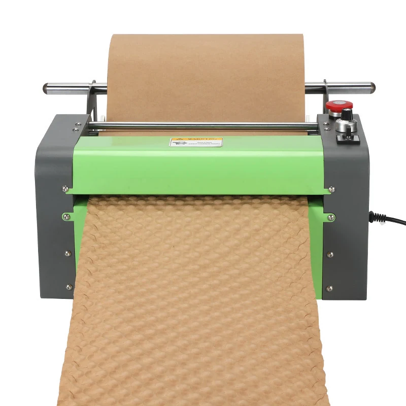 Green and grey machine converting a roll of brown paper into honeycomb protective packing material.