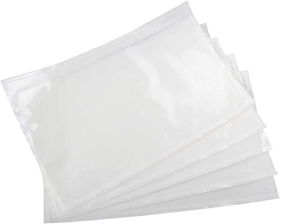 Fan of clear plastic pouches with visible seams arranged diagonally on a plain white background