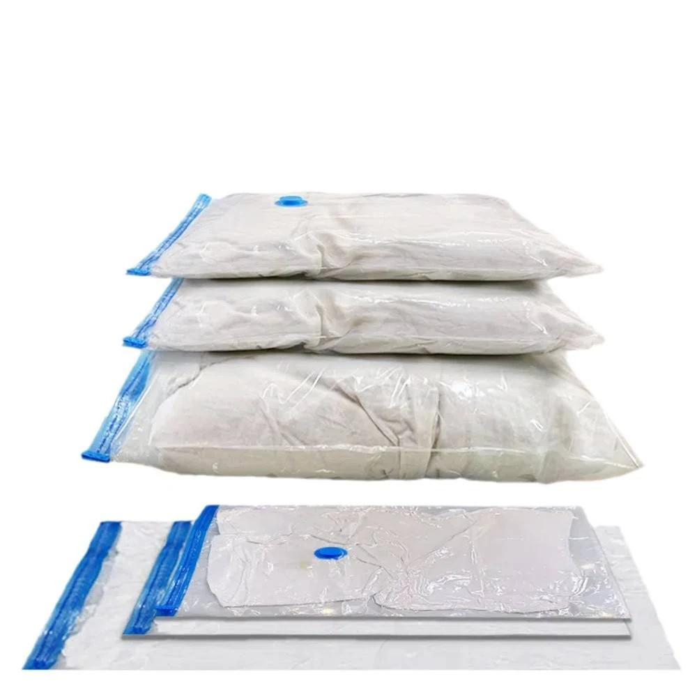 Three stacked vacuum storage bags with blue compression valves above one flat sealed bag on a white background