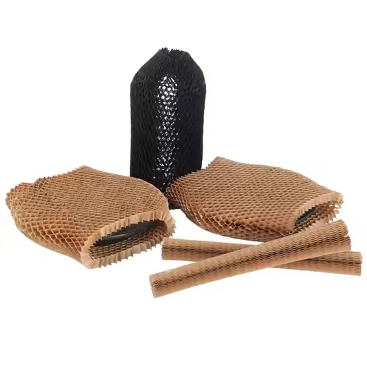 Assorted brown honeycomb humidifier wick pads, one black cylindrical filter, and two rolled strips on white background