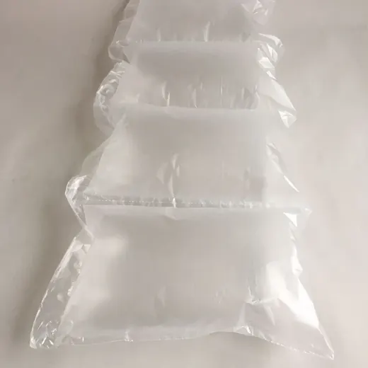 Strip of clear inflated air cushion packaging pillows arranged diagonally on a white surface