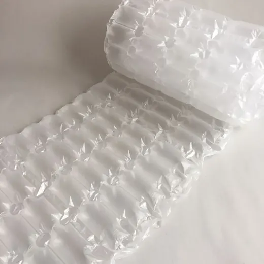 Roll of translucent inflatable air cushion bubble wrap partially unrolled on a plain white background