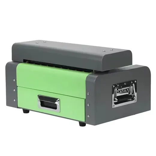 Green and grey industrial machine with metal handles