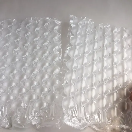 Two sheets of clear inflatable air cushion bubble wrap packaging film on a plain white surface