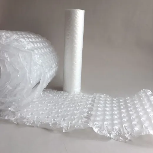 Rolls of white bubble wrap, one upright and one lying flat