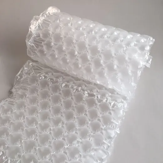 Roll of clear air bubble cushioning film partially unrolled on a plain light gray background
