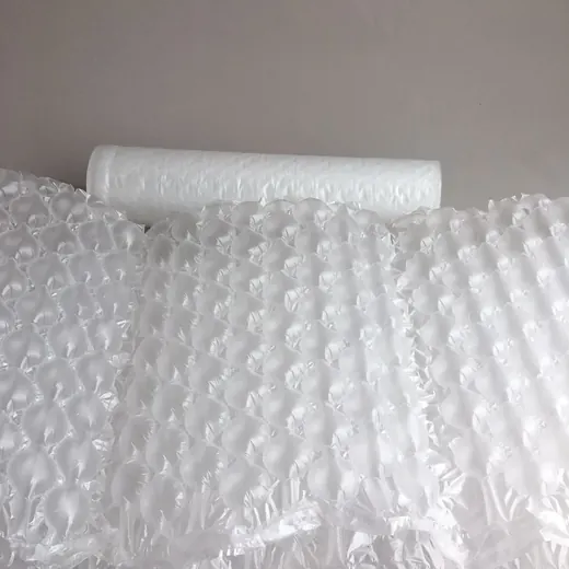 Rolls and draped sheets of translucent white bubble wrap against a plain wall