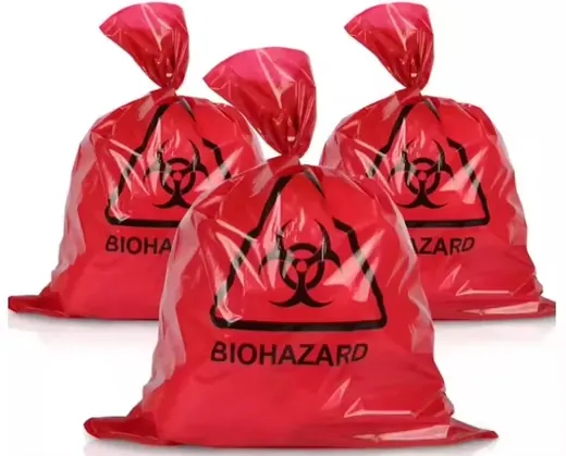 Three red plastic biohazard waste bags with printed biohazard symbols and BIOHAZARD text on a white background