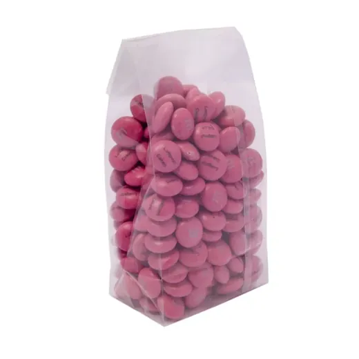 A clear stand-up pouch filled with pink coated candies.