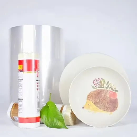 Product display featuring a roll of plastic wrap, a tube of adhesive, and two ceramic plates with a hedgehog design.