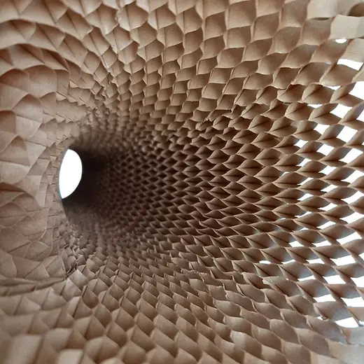 Interior view looking through a cylindrical honeycomb paper structure