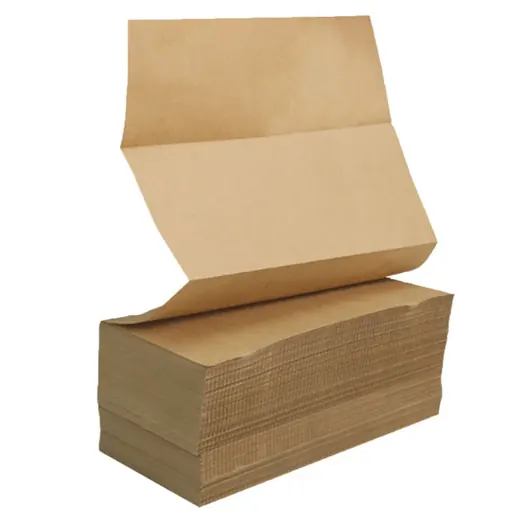 Stack of brown kraft paper sheets with the top sheet partially unfolded, isolated on a white background