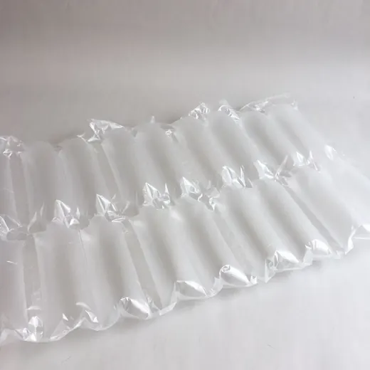 Translucent inflatable air pillow packaging cushions laid out on a white surface