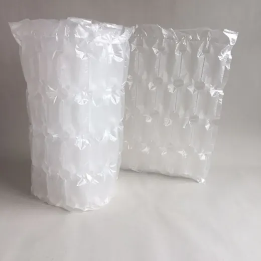 Two clear inflatable plastic packaging air cushions standing upright on a plain white background.