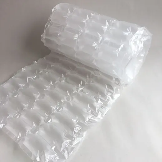 A roll of clear plastic air cushion packaging material partially unrolled on a white background.