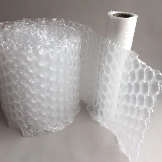 Two transparent bubble wrap rolls on a plain background, one partially unrolled showing the bubble sheet