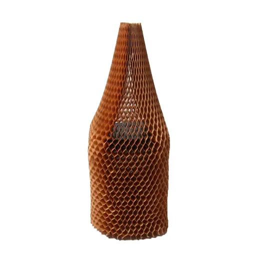 Brown honeycomb paper packaging wrapped around a dark bottle on a white background