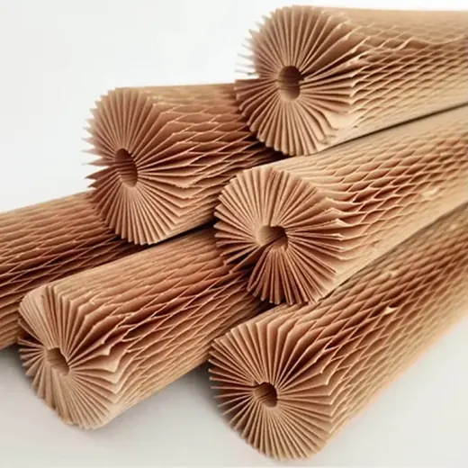 Stacked rolls of kraft honeycomb paper wrap showing pleated honeycomb cells at the open ends