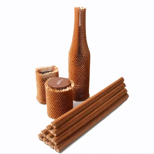 Honeycomb paper packaging material shown expanded around a bottle, jars, and rolled tubes.