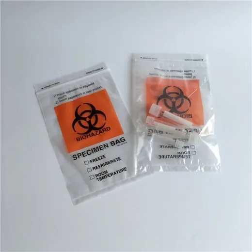 Two specimen biohazard bags, one flat and one containing a tube, on a white surface.
