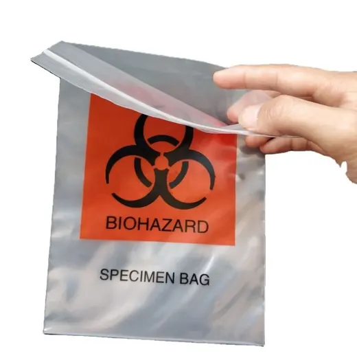 A hand opening a clear plastic biohazard specimen bag with an orange warning label.