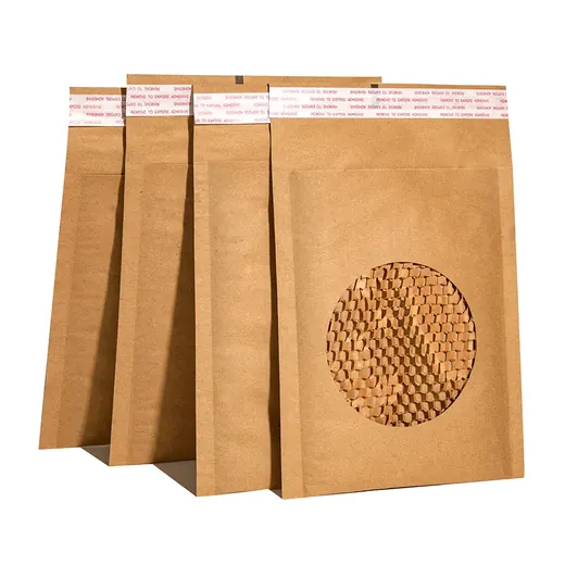 Four brown paper packaging bags with a circular window and pink adhesive strips on white background