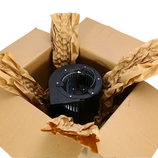 Black blower motor packed in a cardboard box with brown paper cushioning