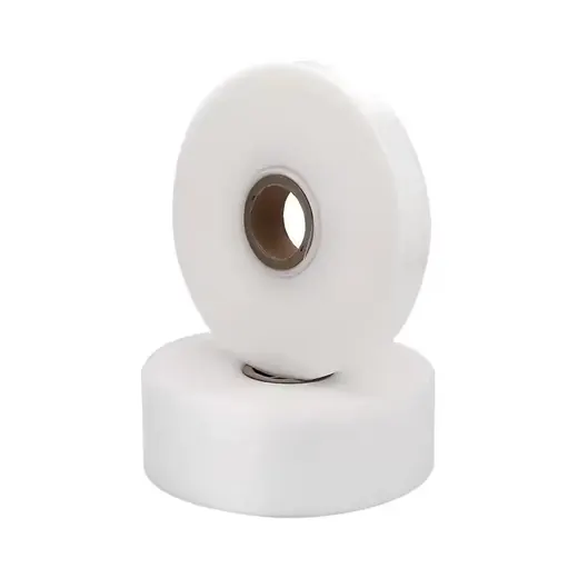 Two white tape rolls with cardboard cores, one leaning against the other, on a plain white background