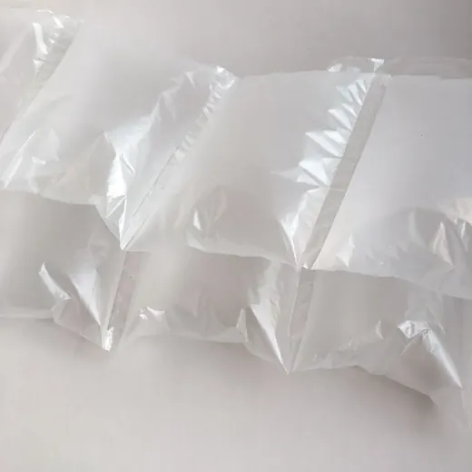 Translucent inflatable air pillow packaging cushions stacked on a plain white background