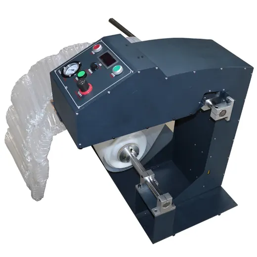 Industrial air pillow machine with a control panel and a roll of bubble wrap.