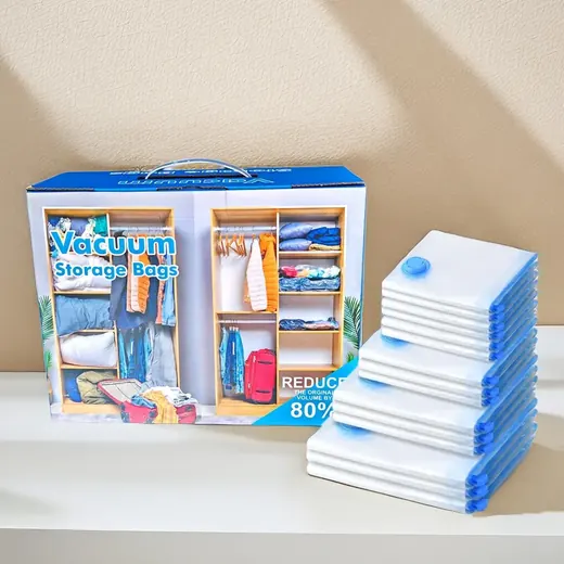 A retail box for vacuum storage bags displayed next to a stack of the white plastic bags with blue valves.
