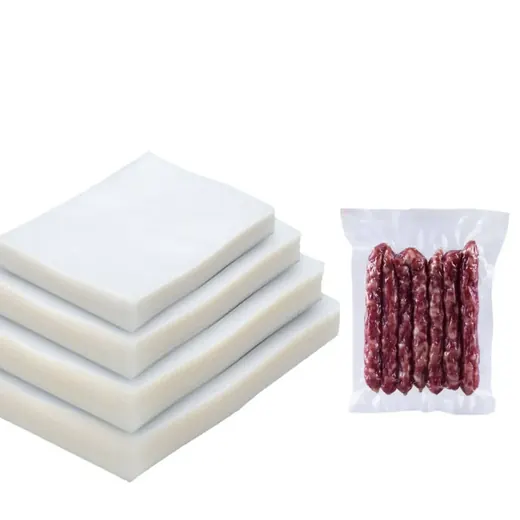 Stacked white vacuum pouch bags next to a vacuum-sealed pack of sausages on a white background
