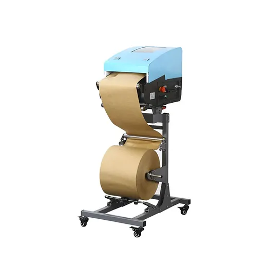 Industrial label rewinder machine with blue housing processing a large roll of brown paper