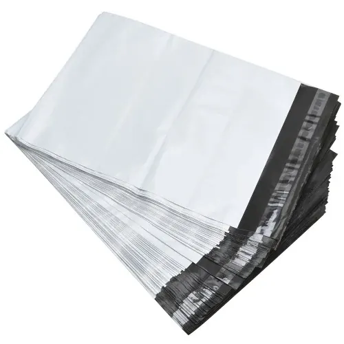Stack of clear plastic poly bags with black adhesive strips