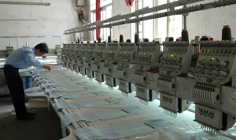 Multi-head embroidery machines stitching panels