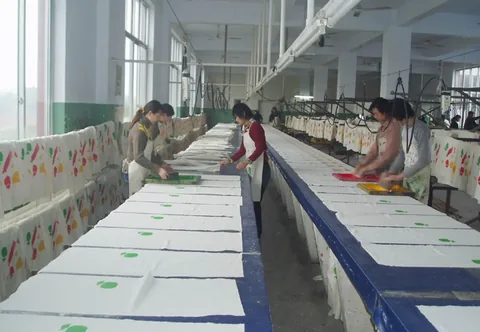 Screen printing line with printed cotton panels laid out