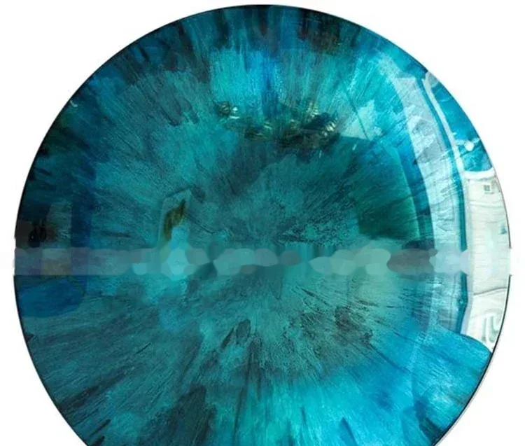 Circular blue and white patterned disc with a blurred watermark across the center.