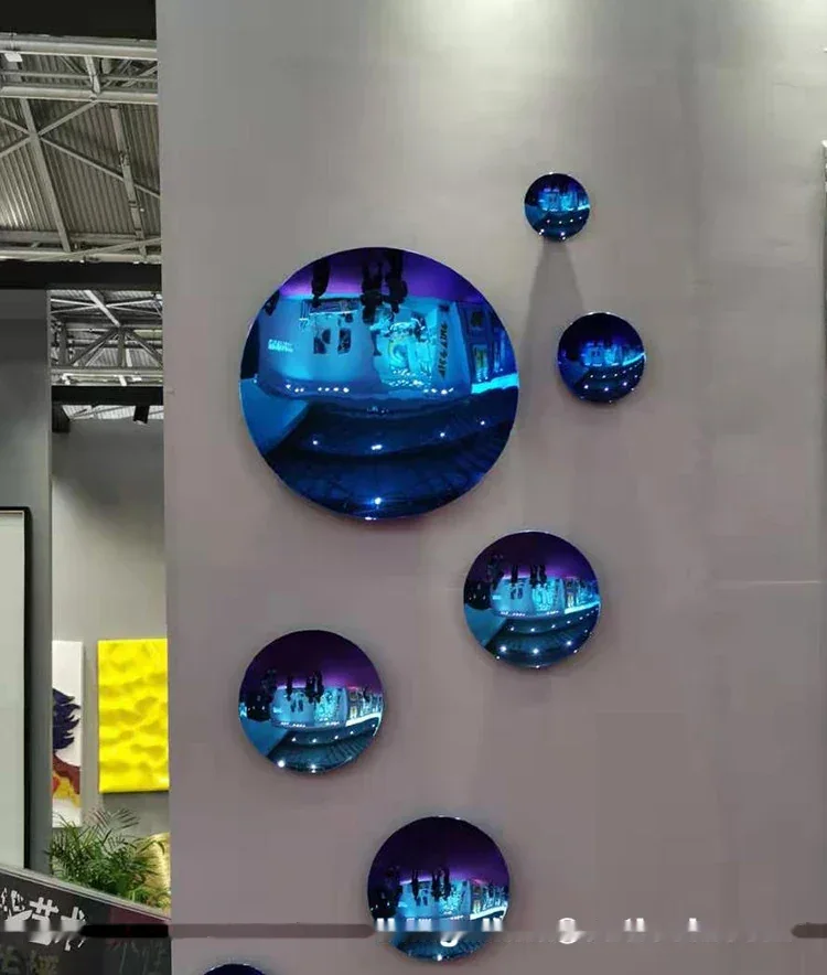 Circular mirrors on a wall at an exhibition stand