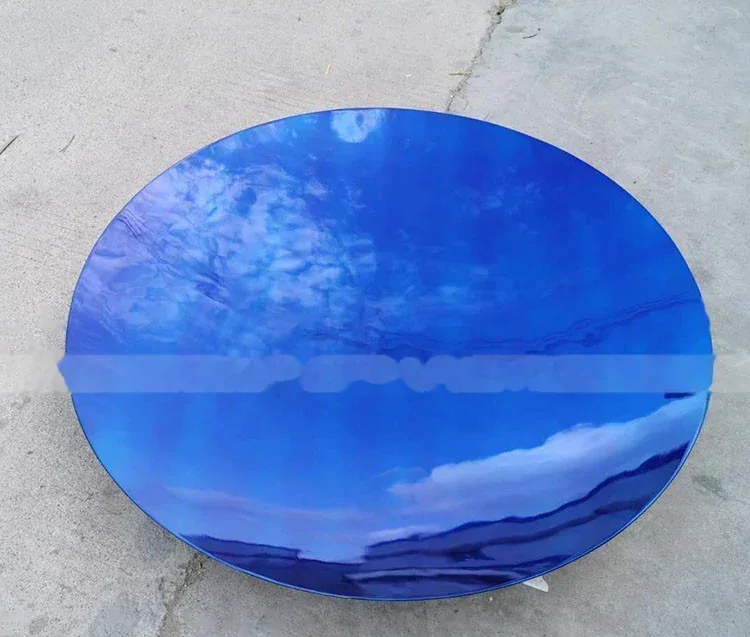 Round blue mirror-finish metal