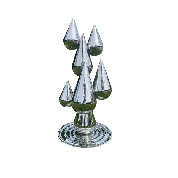 Polished stainless steel sculpture of multiple droplet shapes on a rippled circular base, white background
