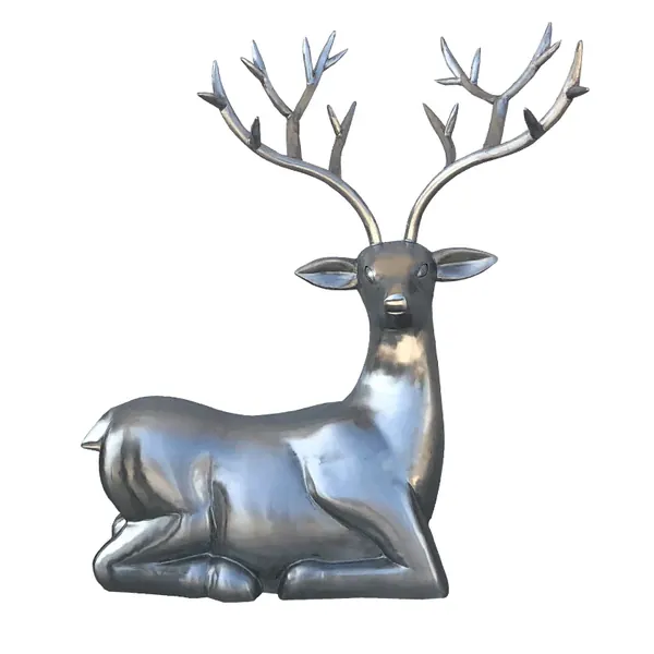 Silver reclining deer figurine with large branched antlers on a plain white background