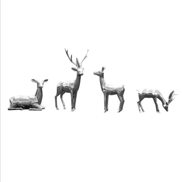 Four silver deer figurines in assorted poses, including one lying down and one grazing, on a white background