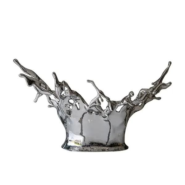 Silver decorative sculpture shaped like a frozen liquid splash