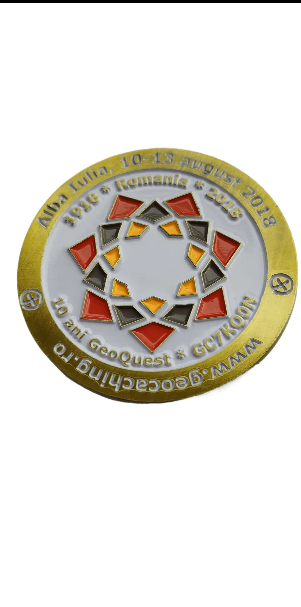 Enamel Inlay Challenge Coin showing a gold coin with a colour enamel geometric inlay