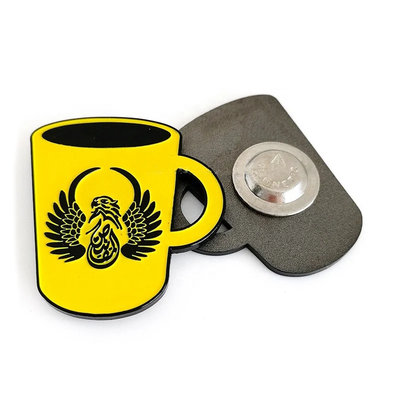 Black nickel enamel badges in a group